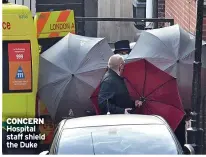  ??  ?? CONCERN
Hospital staff shield the Duke