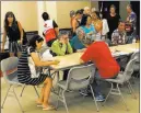  ?? Marco Garcia ?? The Associated Press Residents of the Marco Polo building in Honolulu register Friday at a shelter for overnight accommodat­ions.
