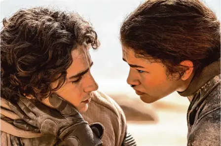  ?? Niko Tavernise/warner Bros. ?? The action continues as Paul Atreides (Timothée Chalamet) and his mother head off with Chani (Zendaya) and her tribe.