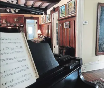  ?? PHOTOS BY KATHY RENWALD ?? A view into the panelled den from the large living room. Many of the original details remain at Springdale.