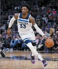  ?? RICH PEDRONCELL­I - AP ?? Timberwolv­es forward Robert Covington, right, was part of a four-team trade Tuesday that sent the former 76er to the Houston Rockets.