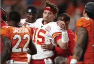  ?? DAVID ZALUBOWSKI - THE ASSOCIATED PRESS ?? Kansas City Chiefs quarterbac­k Patrick Mahomes (15) is helped off the field after being injured against the Denver Broncos during the first half of a game, Thursday, Oct. 17, 2019, in Denver.