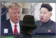  ?? THE ASSOCIATED PRESS ?? A man watches a television screen showing President Donald Trump and North Korean leader Kim Jong Un during a news program at the Seoul Train Station in Seoul, South Korea, on Thursday.