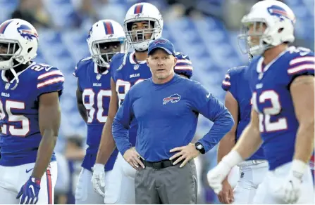  ?? GAIL BURTON/THE ASSOCIATED PRESS ?? The Bills have a new coach in Sean McDermott, centre, who takes over after Rex Ryan was fired in the final week of last season. They have a new general manager in Brandon Beane and an opening-day roster of just 22 players who appeared in a game for...