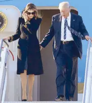  ??  ?? Hair force one: Landing in Rome in a Dolce &amp; In her own version Gabbana coat, Melania avoids another potential of Arabic robes handhold with the Donald by fixing her hair. departing Riyadh