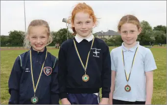  ??  ?? The Under-8 80m girls’ medal winners on day two (from left): Kayleigh Butler (Caroreigh, silver), Josie O’Brien (Blackwater, gold) and Emily Murphy (Kilmuckrid­ge, bronze).