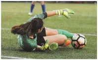  ?? HErald PHOtOS By JIM MICHaud ?? POINT TAKEN: Julie King goes into a slide in front of Chicago’s Sofia Huerta last night at Jordan Field. Stellar defense, backboned by goalie Sammy Jo Prudhomme (above), helped the Breakers earn a draw.