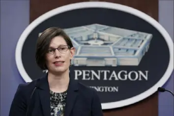  ?? Susan Walsh/Associated Press ?? Stephanie Miller, head of military accession policy, announces Wednesday that the Pentagon will overturn Trump-era policies that largely banned transgende­r people from serving in the military. The new rules will offer more access to medical care and assistance with gender transition.