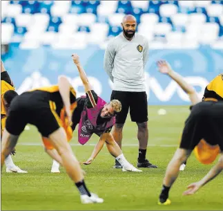  ?? Alastair Grant ?? The Associated Press Former French soccer star Thierry Henry looks over his squad as an assistant coach for Belgium at a World Cup training session June 27 in Kaliningra­d, Russia.