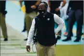  ?? LYNNE SLADKY — THE ASSOCIATED PRESS ?? Dolphins head coach Brian Flores walks the sidelines during the first half against the Seahawks on Oct. 4.