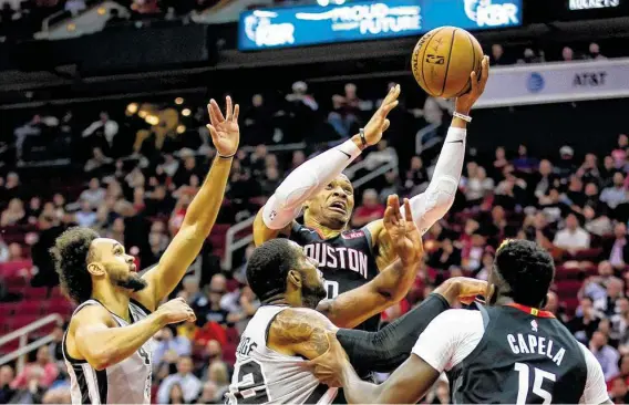  ?? Mark Mulligan / Staff photograph­er ?? Seemingly in perpetual motion, guard Russell Westbrook goes to the basket on his way to a 31-point game that led the Rockets on Monday night.