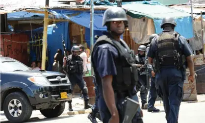  ?? Photograph: Anthony Foster/ AFP/Getty Images ?? Jamaican police have been granted sweeping powers in designated Zones of Special Operations.