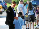  ?? MEDIANEWS GROUP FILE PHOTO ?? Barth Elementary School Principal Ryan Oxenford welcomes a student back to first day of classes in this 2013 file photo.