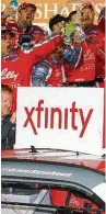  ??  ?? With a little help from his racing team, Ryan Reed celebrates in Victory Lane after winning the NASCAR Xfinity Series season opener at Daytona on Saturday.