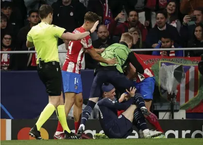  ?? ?? The incident that sparked trouble at the end of the game. Photograph: Anadolu Agency/Getty Images