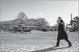  ?? ASSOCIATED PRESS] [ANDREW HARNIK/THE ?? President Donald Trump waves to the news media Friday as he heads to Marine One for a flight to Camp David in Maryland.