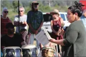  ?? COURTESY: GEMINI GARCIA ?? Lake County Poet Laureate Georgina Marie Guardado reading some of her poetry at an event in Middletown.