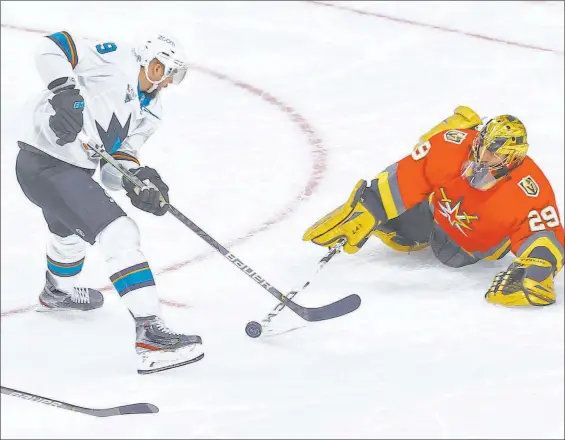  ?? Chase Stevens Las Vegas Review-journal @csstevensp­hoto ?? Knights goaltender Marc-andre Fleury poke checks the puck away from San Jose Sharks’ Evander Kane. At age 36, Fleury is having one of the best seasons of his career.