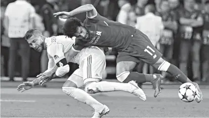  ??  ?? Sergio Ramos’ tackle on Mohamed Salah