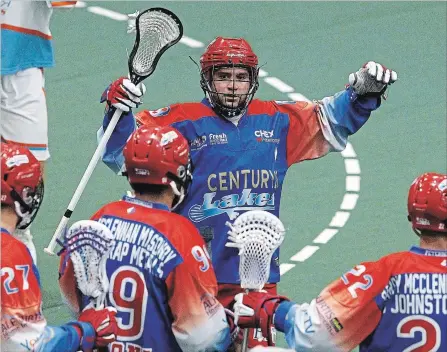  ?? CLIFFORD SKARSTEDT EXAMINER ?? Peterborou­gh Century 21 Lakers’ Shawn Evans (top) celebrates a goal scored on Six Nations Chiefs’ goalie Doug Jamieson during first period Major Series Lacrosse action on Thursday night at the Memorial Centre. The Chiefs won 14-9. More game photos at...