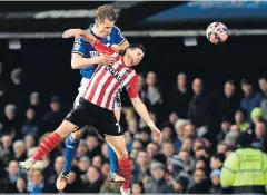  ?? AFP ?? Southampto­n’s Shane Long, right, vies for the ball with Ipswich’s Christophe Berra.