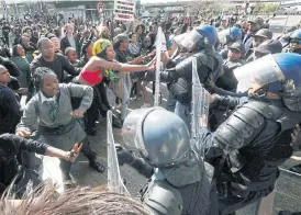  ?? /Esa Alexander ?? Gender-violence protest: Clashes broke out between students and police on Wednesday outside the Cape Town Internatio­nal Convention Centre, where business and political leaders gathered at the African edition of the World Economic Forum. The protest was sparked by the murder of University of Cape Town student Uyinene Mrwetyana.