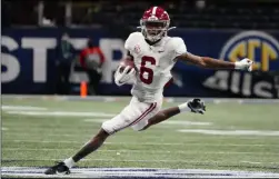  ?? THE ASSOCIATED PRESS ?? Alabama wide receiver DeVonta Smith (6) runs against Florida during the first half of the Southeaste­rn Conference championsh­ip NCAA college football game, Saturday, Dec. 19, 2020, in Atlanta.