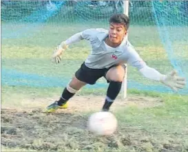  ?? HT PHOTO ?? St Fidelis College goalkeeper dives to his right to stop a free kick during their match in the Chitransh Singh Memorial Inter-School Football Tournament in Lucknow on Sunday.