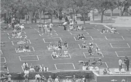  ?? DENIS POROY/ASSOCIATED PRESS ?? Baseball fans sit in social-distance squares during the Diamondbac­ks-Padres game Thursday in San Diego.