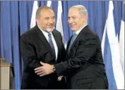  ?? Bernat Armangue Associated Press ?? LIEBERMAN, left, with Netanyahu in 2012. Lieberman resigned as defense minister in late 2018 over the premier’s cease-fire deal with Hamas militants.