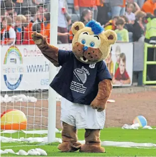  ??  ?? Deewok waving to fans at a Dundee derby match.