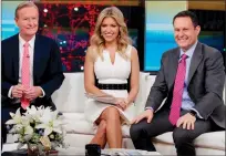  ?? AP PHOTO/RICHARD DREW, FILE ?? "Fox & Friends" cohosts, from left, Steve Doocy, Ainsley Earhardt and Brian Kilmeade appear on their set in New York.