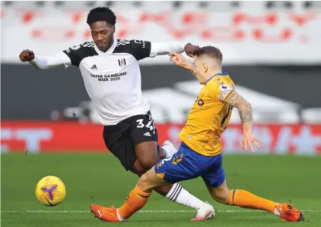  ?? AFP ?? Fulham’s Nigerian defender Ola Aina, left, vies with Everton’s French defender Lucas Digne during the English Premier League match in London on Sunday.