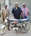  ??  ?? Three of the suspected fake NDLEA officials, with one of them putting on a police uniform
