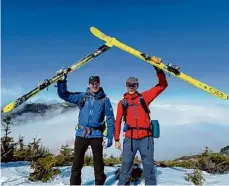  ?? Photo courtesy of Jamie Kennard ?? Jamie Kennard celebrates his 50th birthday with his brother Doug atop Mount Colden, having skied all of the classic high peaks in New York’s mountain regions.