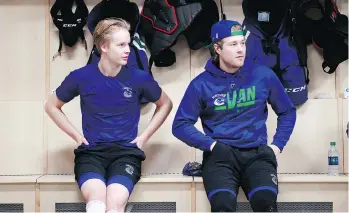  ??  ?? Elias Pettersson, left, and Brock Boeser are roommates on the road.