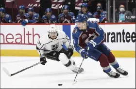  ?? Andy Cross / /The Denver Post ?? Colorado Avalanche defenseman Cale Makar (8) guides the puck past Los Angeles Kings left wing Carl Grundstrom (91) in the third period at Ball Arena May 12.
