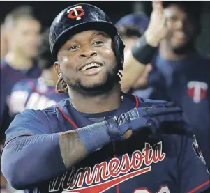  ?? AP PHOTO ?? In this May 22, 2017, file photo, Minnesota Twins’ Miguel Sano celebrates his two-run home run with teammates in the dugout in the ninth inning of a baseball game against the Baltimore Orioles, in Baltimore.