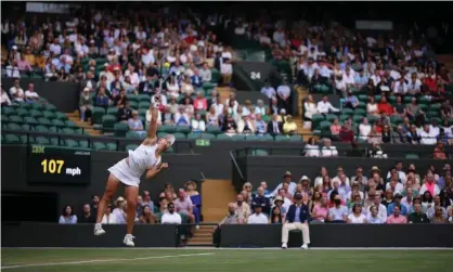  ?? Photograph: Steven Paston/PA ?? Ashleigh Barty serves on No 1 Court during her 7-5, 6-3 victory against Barbora Krejcikova, a result that took the world No 1 to her first Wimbledon quarter-final.