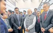  ?? PTI ?? Prime Minister Narendra Modi and his Singapore counterpar­t Lee Hsien Loong (extreme right) at the Enterprise and Innovation Exhibition­s in Singapore on Thursday.