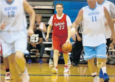  ?? MIKE STOCKER/STAFF PHOTOGRAPH­ER ?? Louisville basketball coach Rick Pitino brings the ball up with the Red Birds team in the 55-over Division in the National Masters Basketball Championsh­ip in Coral Springs.