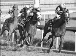  ?? JIM LEUENBERGE­R ?? Authentic (right) at 8-1 and odds-on favorite Tiz the Law were head to head in upper stretch of the 146th Kentucky Derby