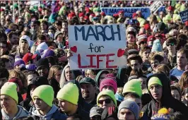  ?? ALEX WONG / GETTY IMAGES ?? Anti-abortion activists take part Friday in a rally on the National Mall in Washington, D.C., before the 2018 March for Life, an annual event that protests the Supreme Court’s 1973 decision in Roe v. Wade that legalized abortion. President Donald Trump addressed the marchers by video link.