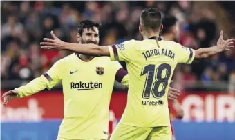  ?? Photo by EPA-EFE ?? Messi celebrates with Jordi Alba