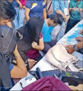  ?? GHIO ONG ?? Norodian Samplidan (in light blue shirt), Lady Jane Borja and Regina San Miguel are presented in a press conference at the Alabang Town Center in Muntinlupa City following their arrest for selling P50 million worth of shabu yesterday.