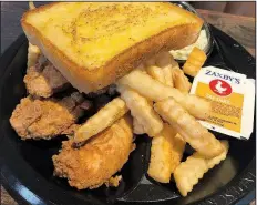  ?? Arkansas Democrat-Gazette/JENNIFER CHRISTMAN ?? The Chicken Fingerz Plate comes with fries, cole slaw and Texas toast at the new Zaxby’s in west Little Rock.