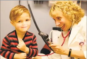  ?? Steve Hamm / Conn. Health I-Team ?? Marc Maldonado, 2, from Fair Haven Heights, is examined by Dr. Pamela Kwittken, the pulmonary specialist at the asthma clinic at Fair Haven Community Health Care.