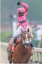  ?? MICHAEL CLEVENGER/COURIER JOURNAL ?? Maximum Security, with Luis Saez aboard, crossed the finish line first Saturday in the 145th Kentucky Derby.