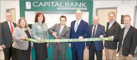  ?? PHOTO PROVIDED ?? A ribbon cutting ceremony is held for the new Capital Bank branch located in Wilton Plaza.