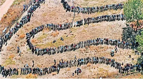  ?? | AP ?? PEOPLE stand in line to cast their votes in South Africa’s first democratic elections on April 27, 1994, in which Nelson Mandela was elected president and the Rainbow Nation was born. Nonraciali­sm is South Africa’s unique contributi­on to the global war against racism, says the writer.